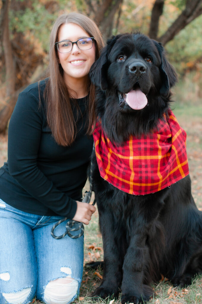 Woman with large black dog