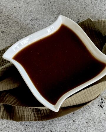 Brown gravy in white bowl